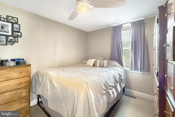 a bathroom with a toilet a sink and a mirror