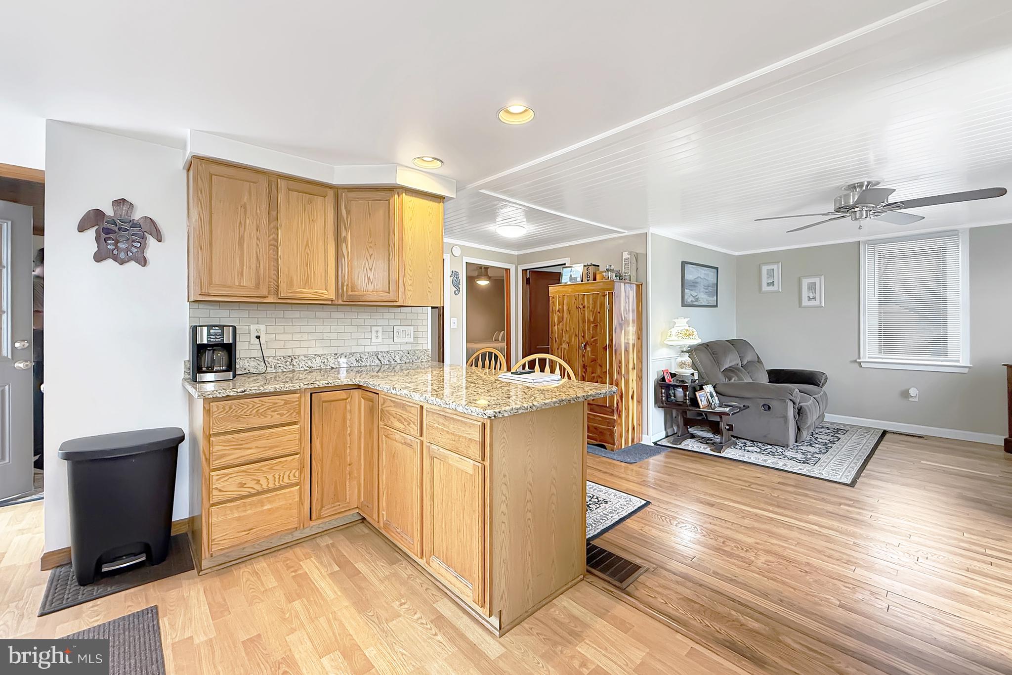 414 Conwell Street Milton, DE 19968 - Photo 16 of 22 Kitchen and Front Living Area