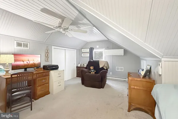 a room with furniture and flat screen tv