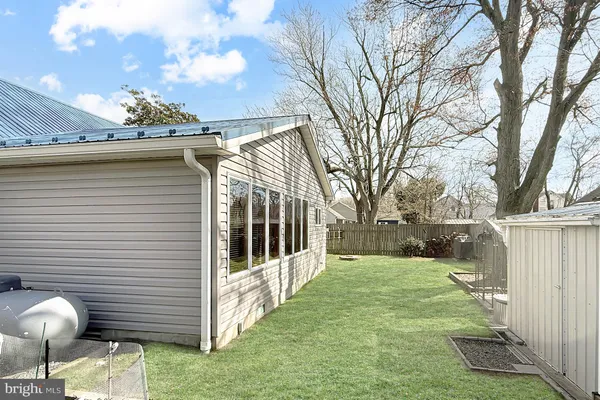 a view of a backyard with parked area