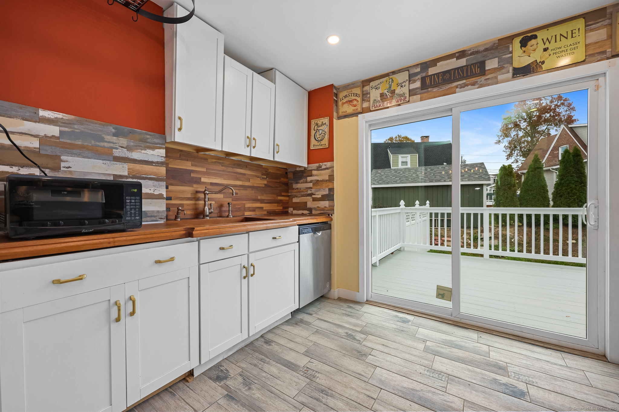 516 Valley Road Stratford, CT 06615 - Photo 18 of 40 Tile floor and slider to sunny deck