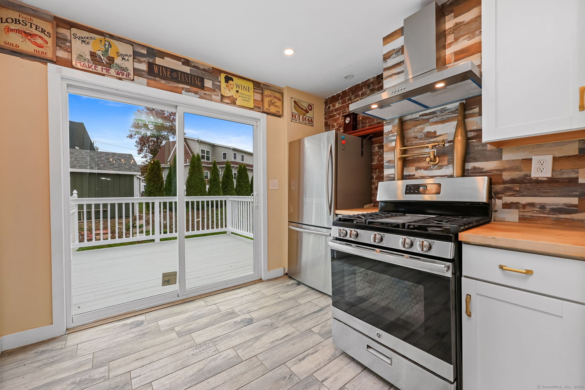 516 Valley Road Stratford, CT 06615 - Photo 19 of 40 Gas range and slider to large deck