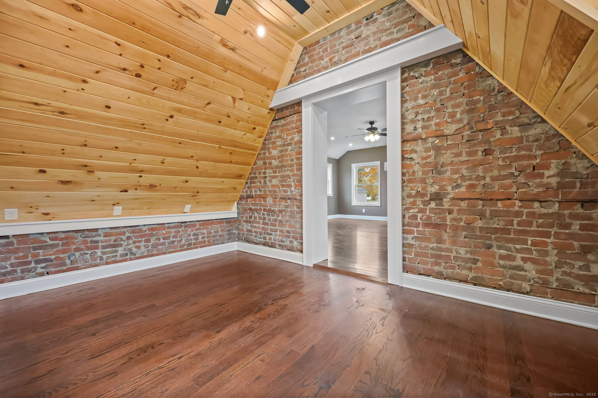 516 Valley Road Stratford, CT 06615 - Photo 24 of 40 Den/3rd BR with hardwood, brick and pine cathedral ceiling with fan
