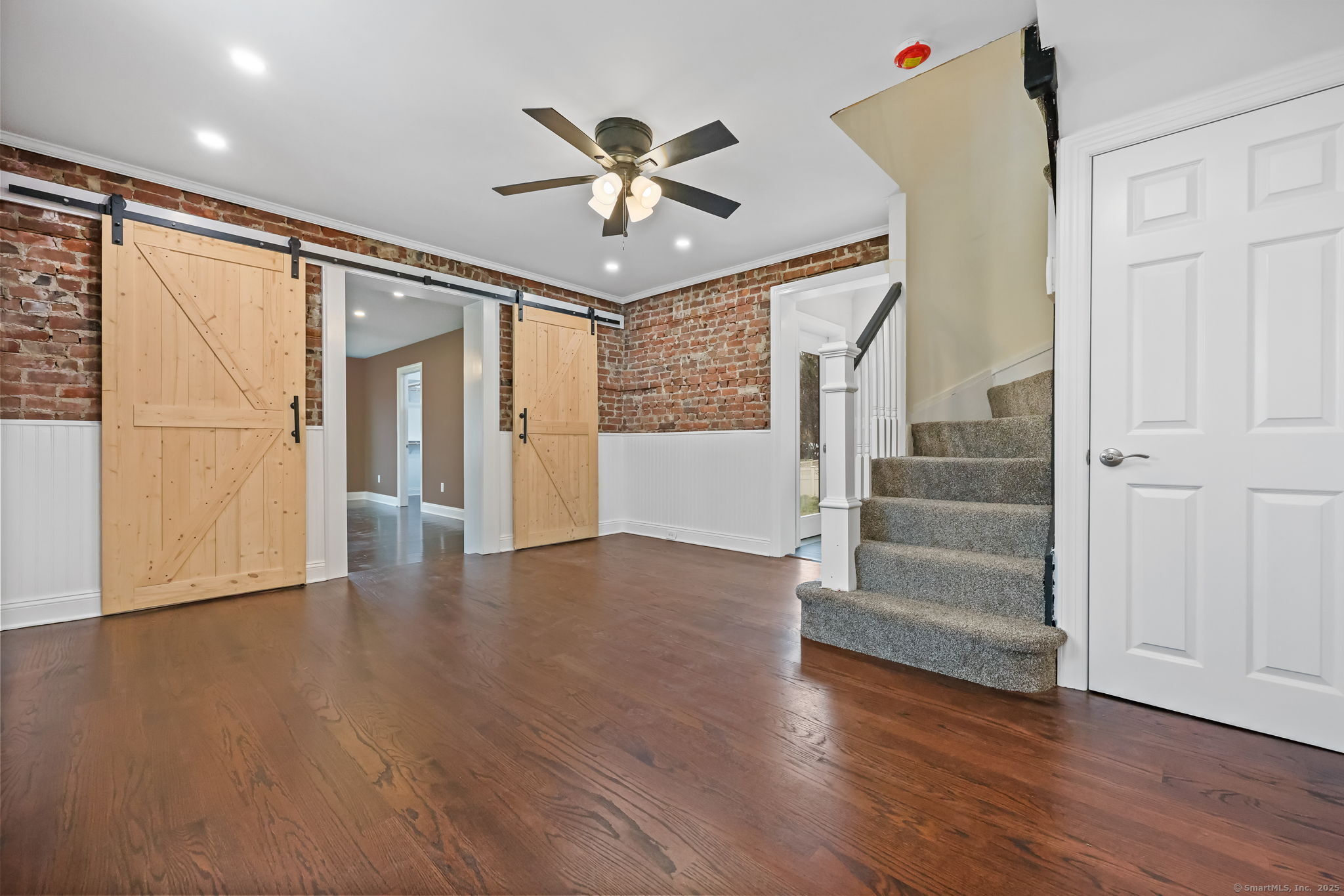 516 Valley Road Stratford, CT 06615 - Photo 5 of 40 Hardwood floors & Barn doors separate Family room