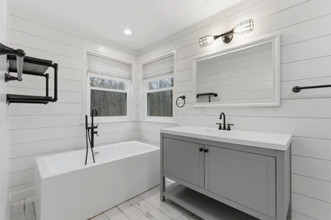 a bathroom with a sink and a bathtub