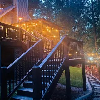 a view of a chairs and table in backyard