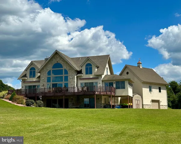 a front view of a house with a big yard