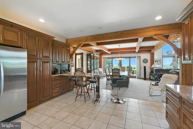 a view of a dining room with furniture wooden floor and chandelier