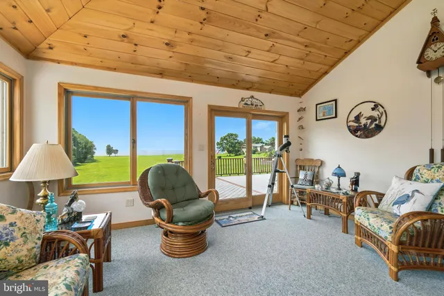 a bedroom with furniture and a flat screen tv