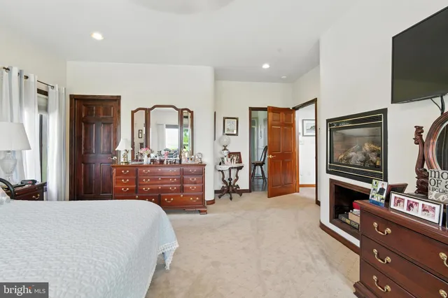 a bedroom with a large bed and a large window