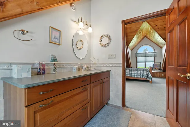 a bedroom with furniture and a window