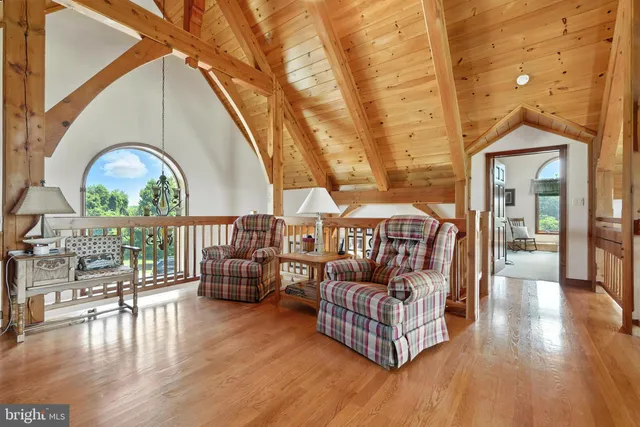 a bathroom with a granite countertop sink vanity and mirror