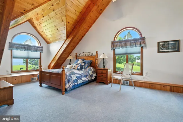 a living room with furniture fireplace and floor to ceiling window