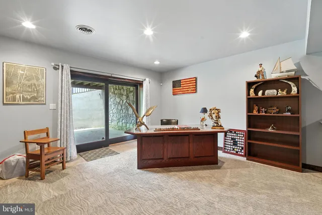 a view of a livingroom with furniture and a garage