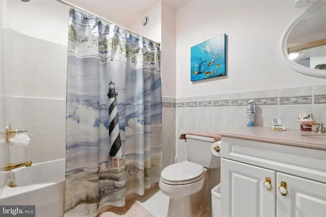 a view of a lake with houses in the back