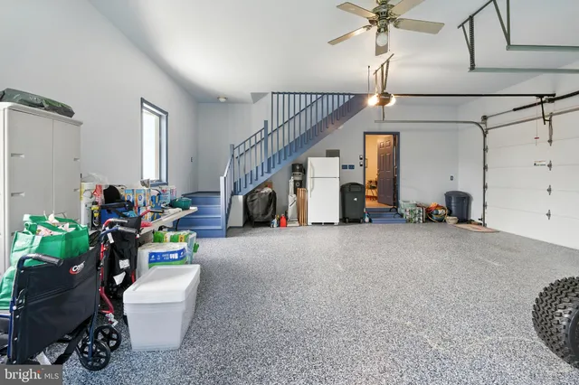 a aerial view of a house with swimming pool and a yard