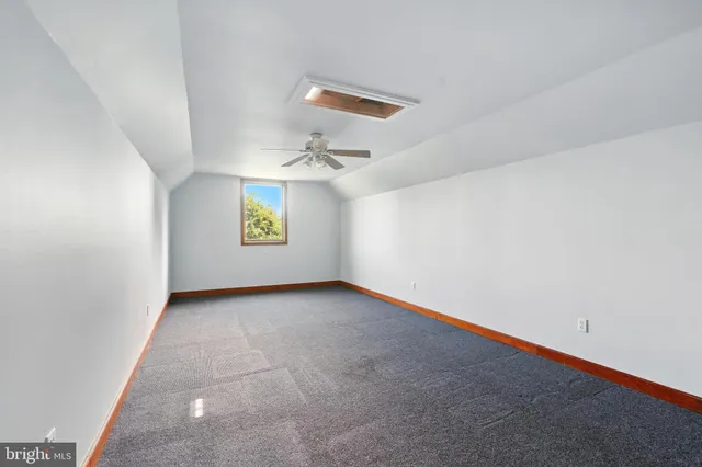 a view of a golf course with an ocean