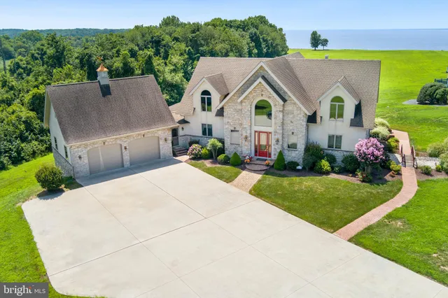 a view of a house with wooden deck