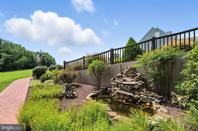a front view of house with yard and outdoor seating