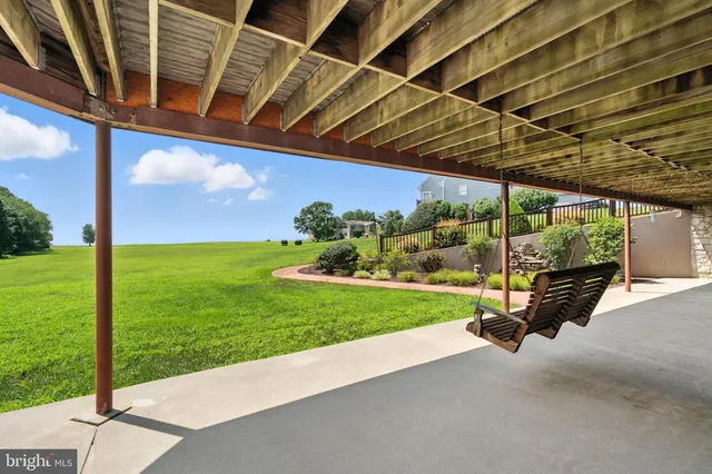 a living room with furniture pool table and flat screen tv