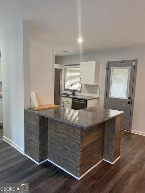 2899 Gresham Rd S East Atlanta, GA 30316 - Photo 11 of 17 a kitchen with kitchen island sink and cabinets