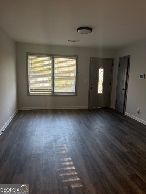 2899 Gresham Rd S East Atlanta, GA 30316 - Photo 13 of 17 an empty room with wooden floor and windows