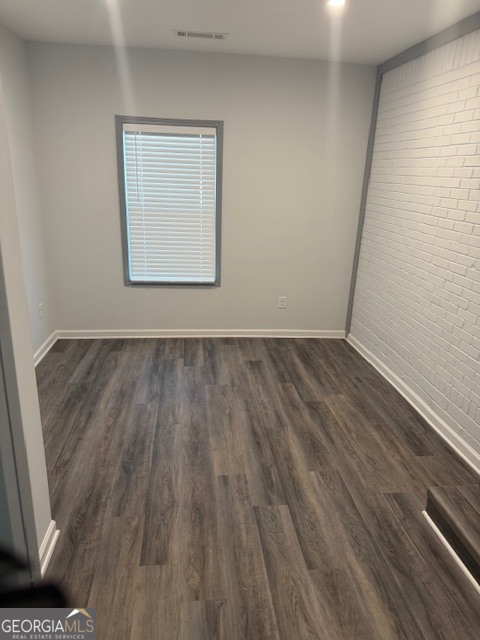 2899 Gresham Rd S East Atlanta, GA 30316 - Photo 16 of 17 a view of an empty room with wooden floor and a window