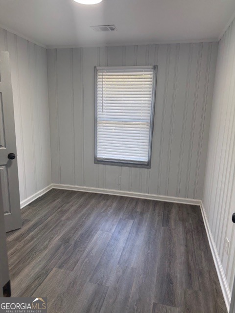2899 Gresham Rd S East Atlanta, GA 30316 - Photo 4 of 17 a view of an empty room with wooden floor and a window