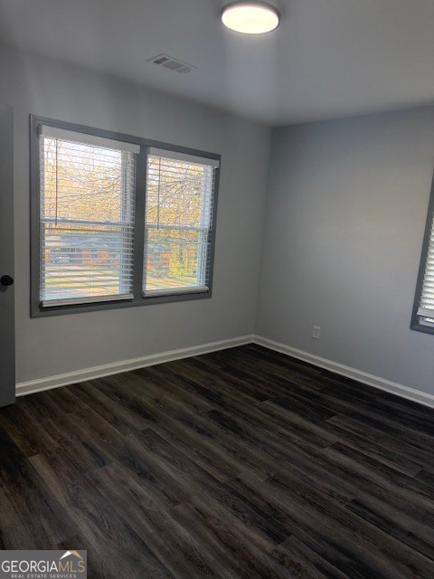 2899 Gresham Rd S East Atlanta, GA 30316 - Photo 5 of 17 a view of an empty room with wooden floor and a window