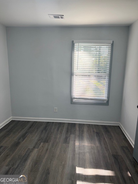 2899 Gresham Rd S East Atlanta, GA 30316 - Photo 6 of 17 an empty room with wooden floor and windows
