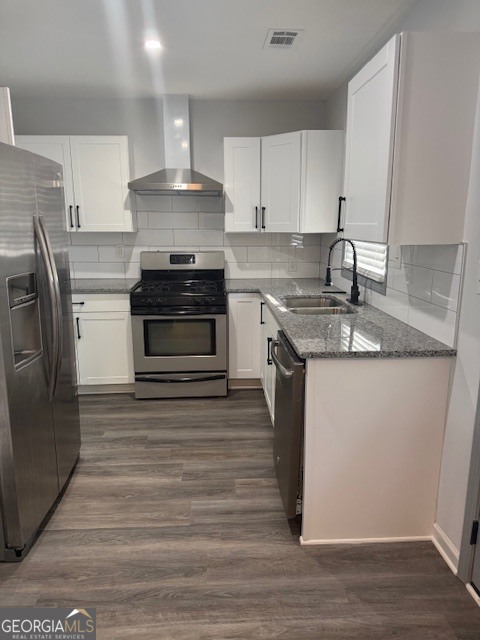 2899 Gresham Rd S East Atlanta, GA 30316 - Photo 10 of 17 a kitchen with stainless steel appliances granite countertop a stove a sink and a refrigerator