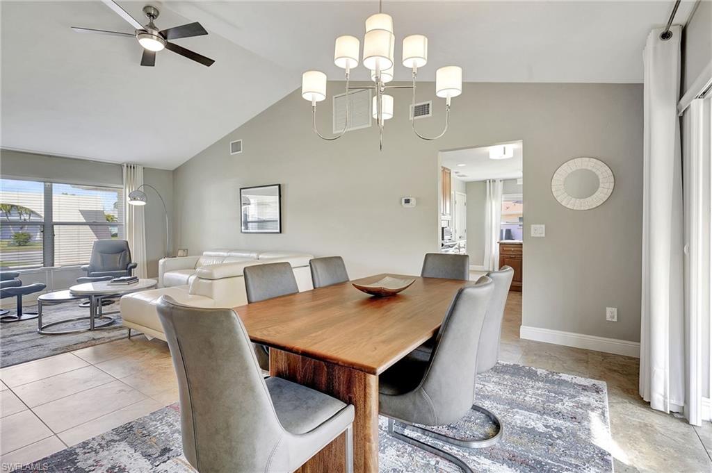 112 Versailles Circle Naples, FL 34112 - Photo 11 of 50 a view of a dining room with furniture