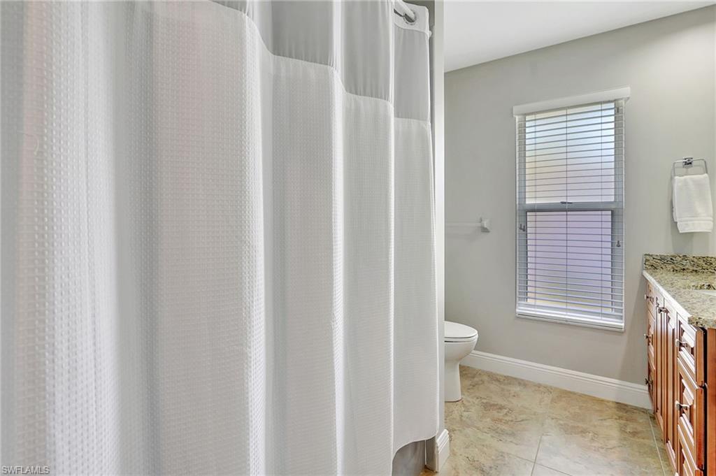 112 Versailles Circle Naples, FL 34112 - Photo 24 of 50 a view of bathroom with shower and a yard