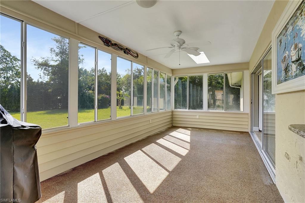 112 Versailles Circle Naples, FL 34112 - Photo 28 of 50 a view of a room with wooden floor and windows