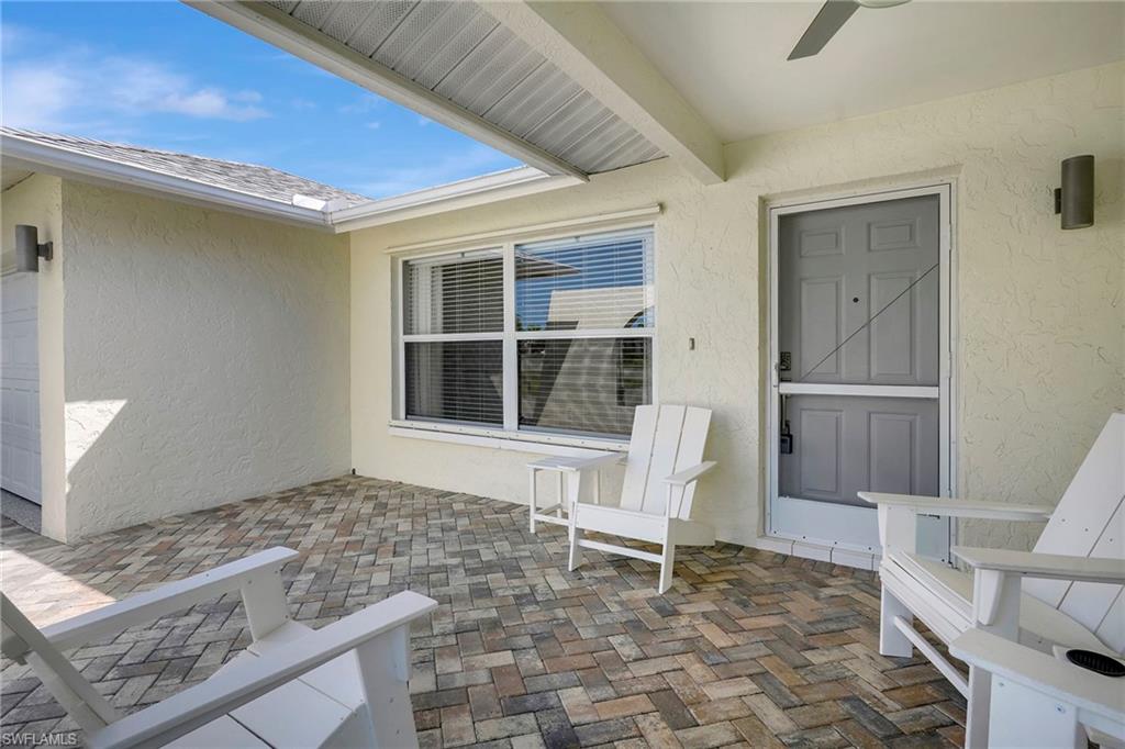 112 Versailles Circle Naples, FL 34112 - Photo 3 of 50 a living room with furniture and a window