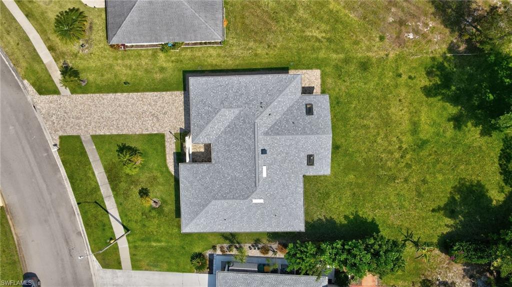 112 Versailles Circle Naples, FL 34112 - Photo 33 of 50 an aerial view of a house with garden space and a swimming pool