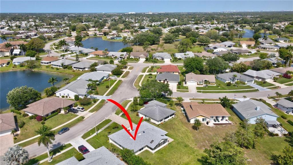 112 Versailles Circle Naples, FL 34112 - Photo 34 of 50 an aerial view of residential houses with outdoor space