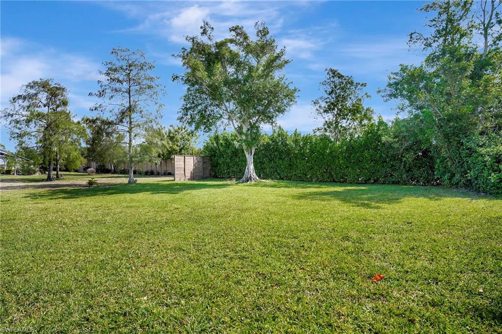 112 Versailles Circle Naples, FL 34112 - Photo 38 of 50 a garden view