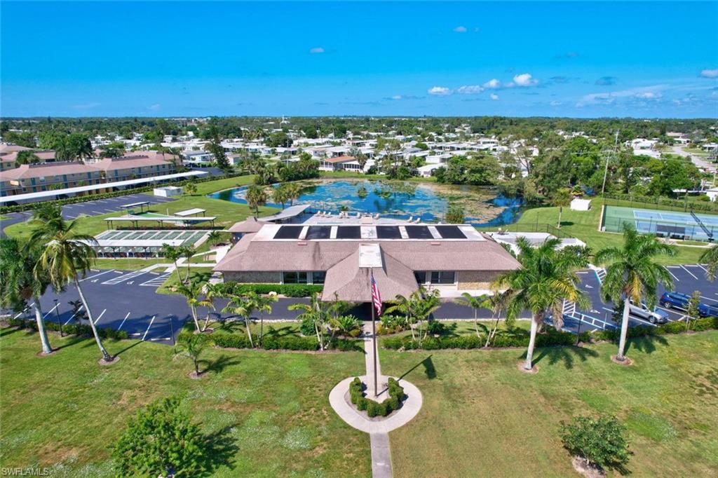 112 Versailles Circle Naples, FL 34112 - Photo 39 of 50 a view of a swimming pool patio and outdoor seating