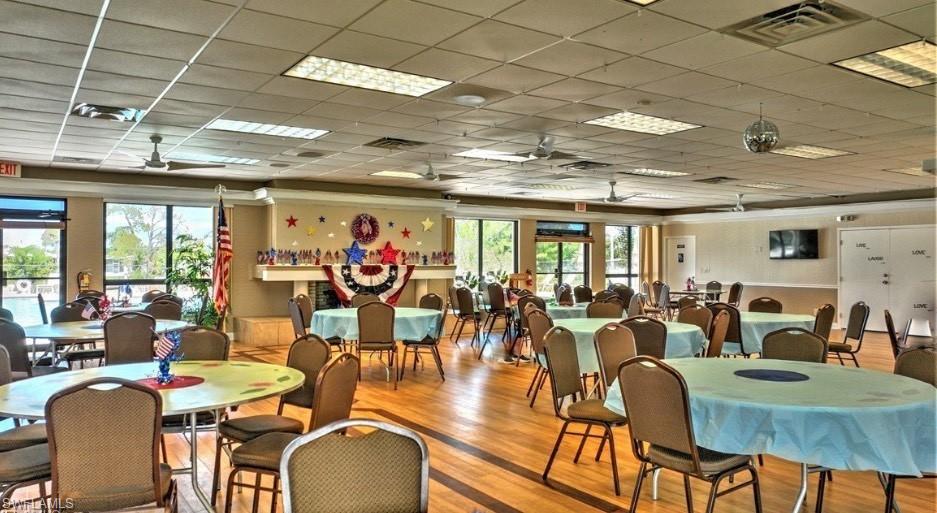 112 Versailles Circle Naples, FL 34112 - Photo 40 of 50 a view of a dining room with lots of furniture and chandelier