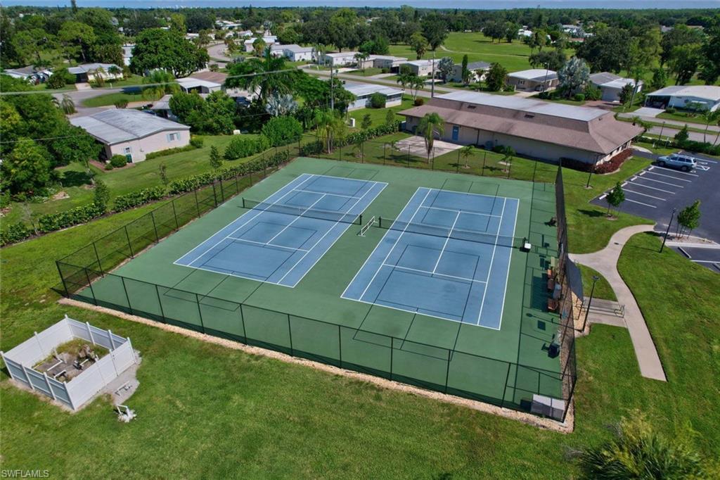 112 Versailles Circle Naples, FL 34112 - Photo 42 of 50 a view of a backyard with sitting area