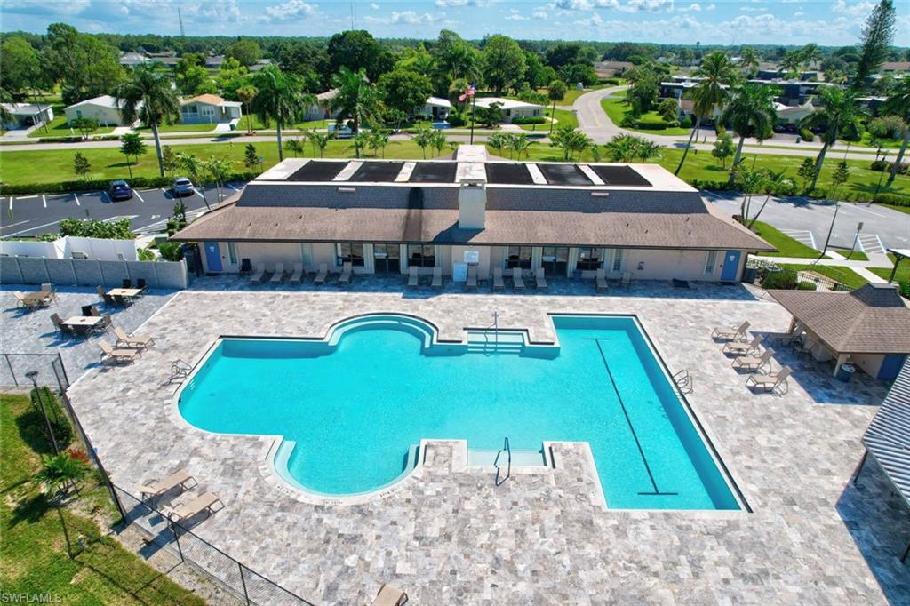 112 Versailles Circle Naples, FL 34112 - Photo 44 of 50 a view of a swimming pool with a patio and plants