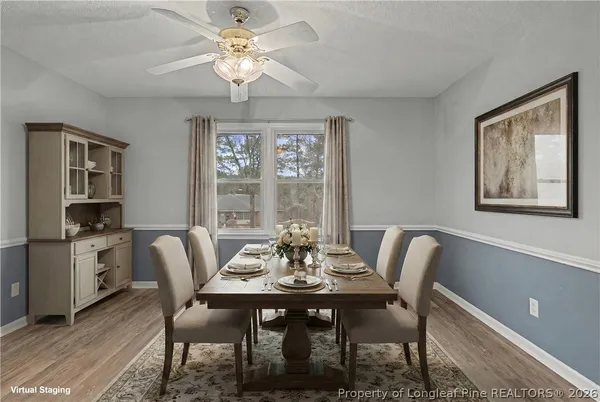 a living room with furniture fireplace and a table