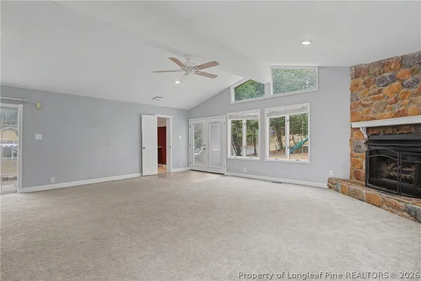 a view of a kitchen with stainless steel appliances granite countertop a sink and cabinets