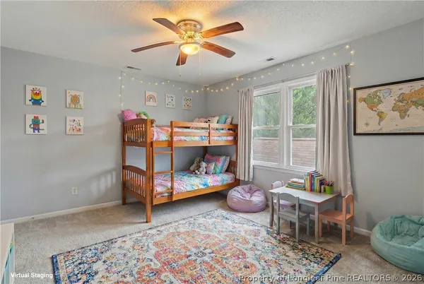 an empty room with closet and a ceiling fan