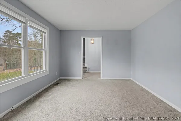 a view of a kitchen with a sink and a window