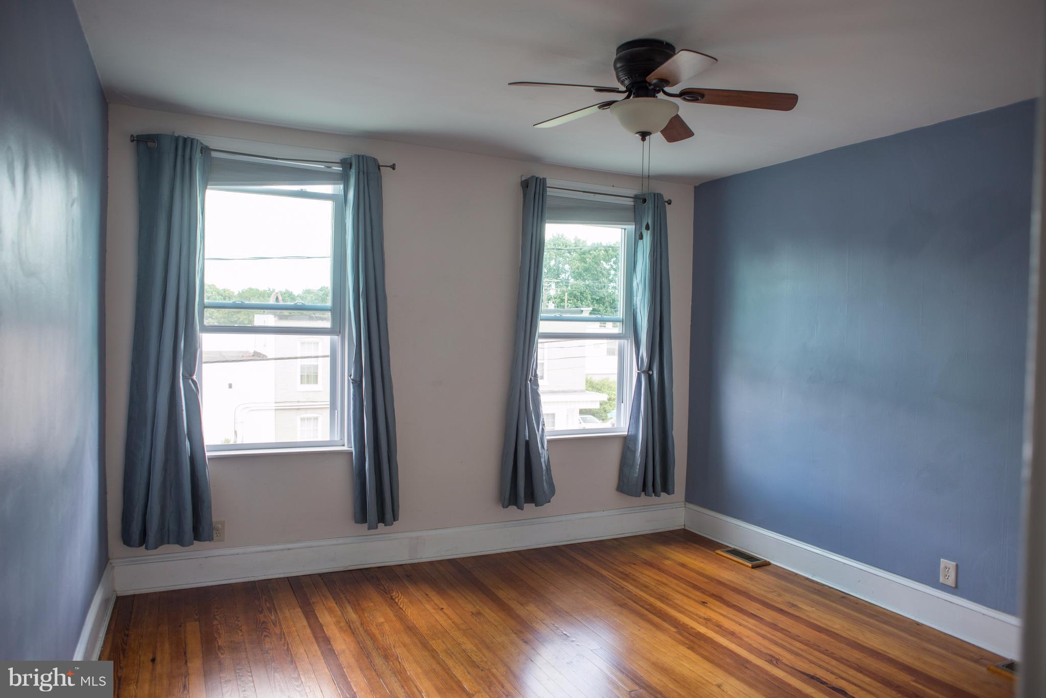 3652 Keswick Road Baltimore, MD 21211 - Photo 11 of 16 a view of empty room with wooden floor and fan
