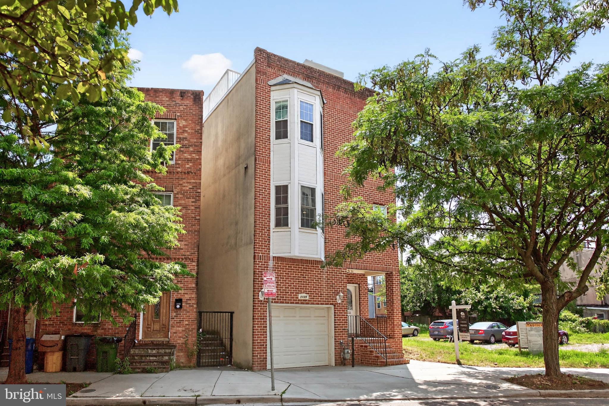 front view of a house with a street