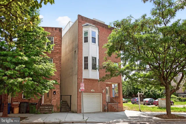 front view of a house with a street