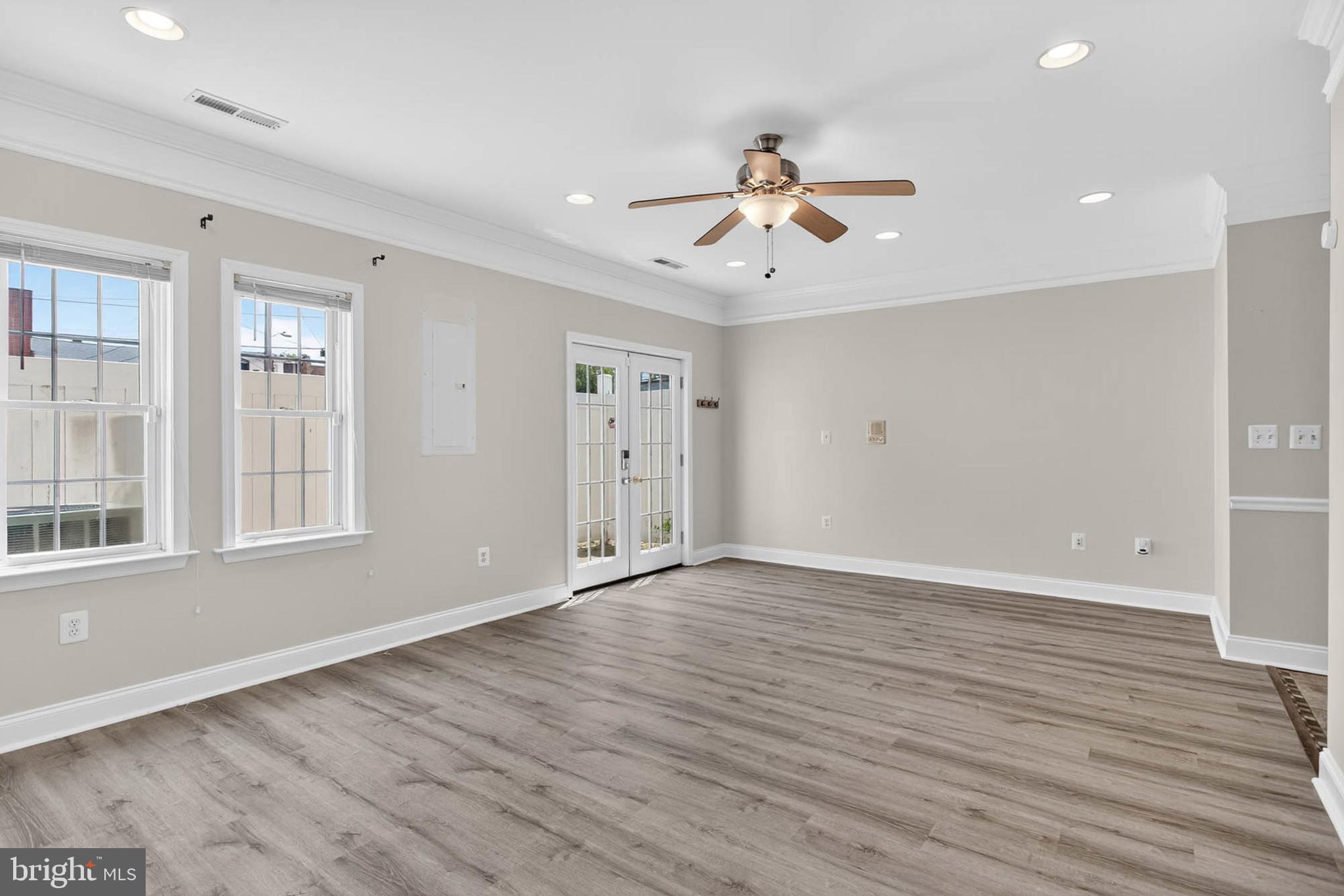 1125 Race Street Baltimore, MD 21230 - Photo 24 of 43 a view of an empty room with wooden floor and a window